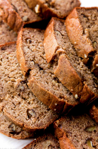 A close-up slice of easy banana bread showing a soft and fluffy bakery-style crumb texture
