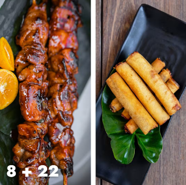 A festive spread of charred Filipino pork BBQ skewers and golden-brown crispy lumpia spring rolls served with a side of sweet chili dipping sauce.