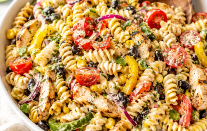A large bowl of colorful Southwest Fajita Pasta Salad packed with black beans, corn, bell peppers, and grilled chicken, tossed in a creamy lime dressing.
